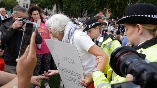 Police attempting arrest for protesting against genocide Police attempting arrest for protesting against genocide